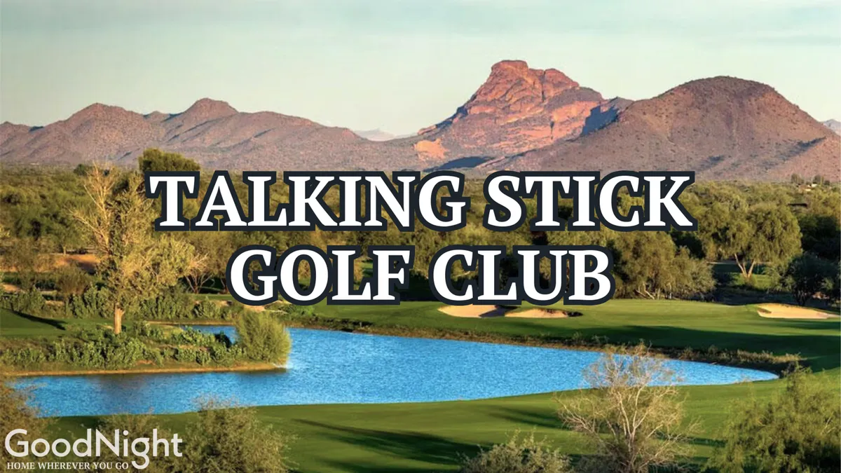 A lush, scenic golf course stretches out with a tranquil lake and distant mountain backdrop. The immaculately maintained greens are framed by trees and water features, capturing the serene beauty and recreational appeal of the area.