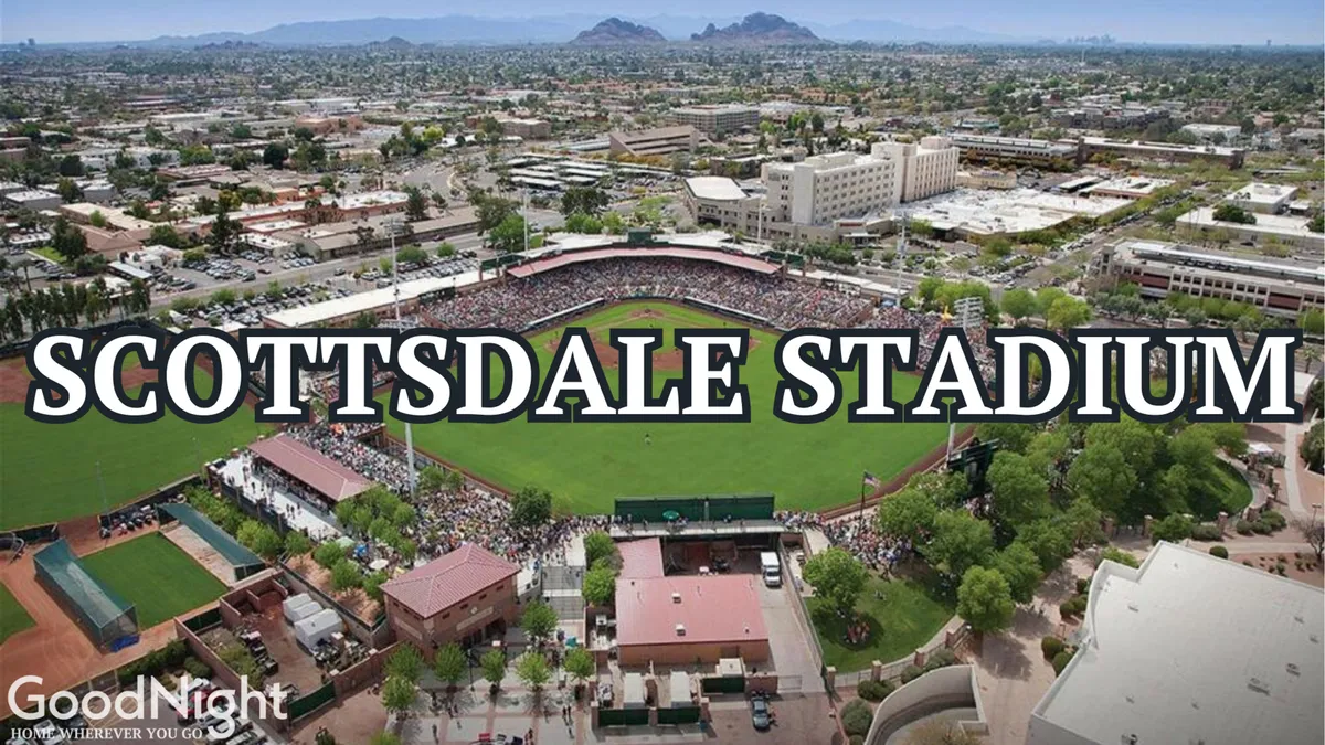 Scottsdale Stadium is alive with energy in this image, showing a crowd of people enjoying a sunny baseball game. The baseball field and surrounding downtown buildings set the scene for local sports and social activities.