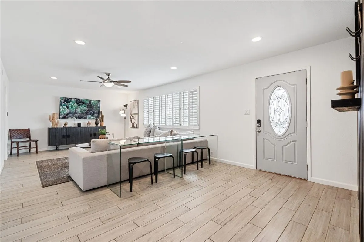 A bright, inviting dining space with a glass dining table, stylish decor, and large windows. The area is set for family gatherings, entertaining guests, or enjoying casual meals, reinforcing the section's focus on togetherness.